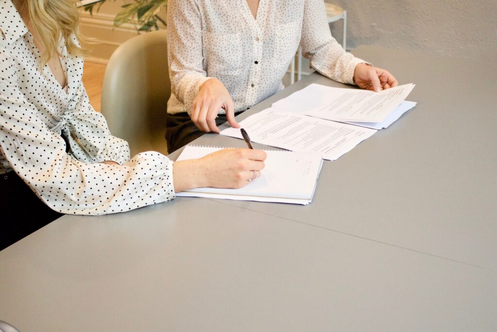 landlord and tenant signing a lease, including a security deposit agreement