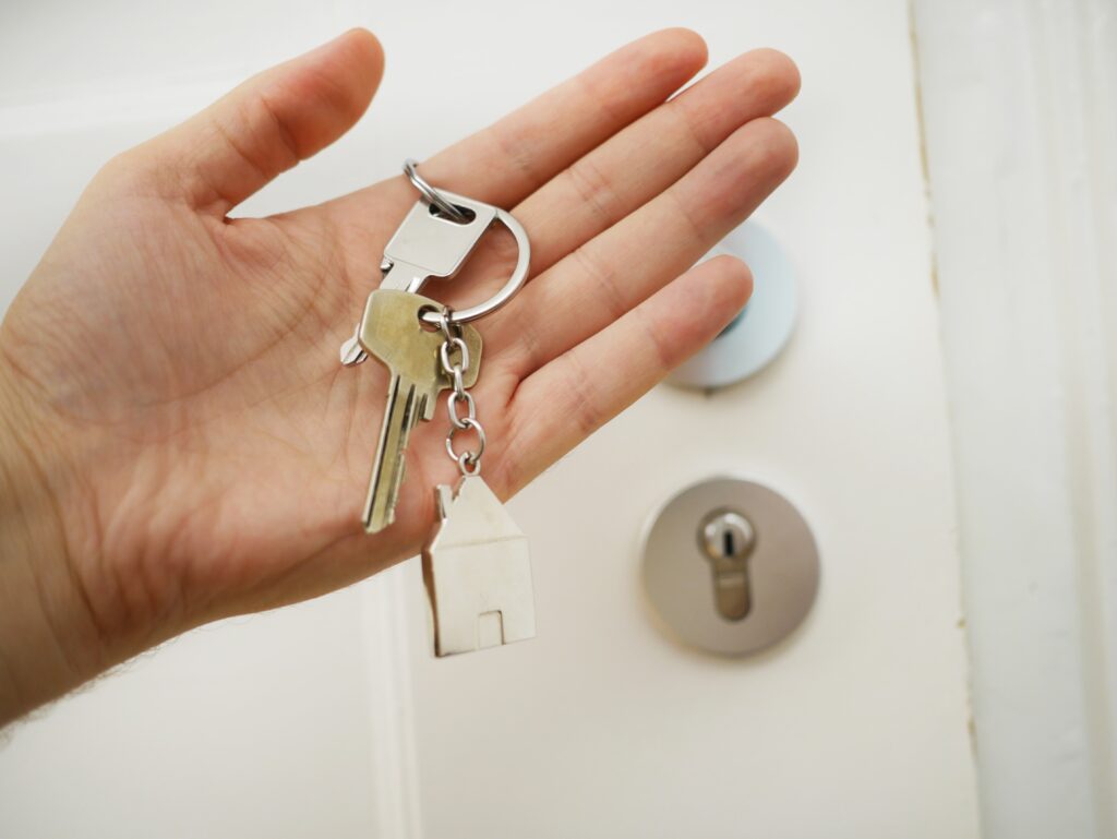 a new york city homeowner holding a key 